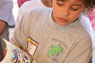 Boy reads at Book Fair
