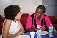 Luciana Da Cruz Brito, left, of Brazil, chats with fellow Fulbright recipient Maxine Browne, of St. Vincent.