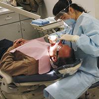 Dental hygienist with patient