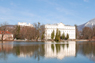 The historic Leopoldskron Palace, nestled by a small lake and offering majestic mountain views.