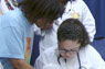 Student in scrubs and female patient