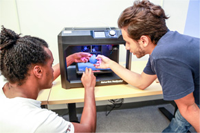 Students working in with 3D printer