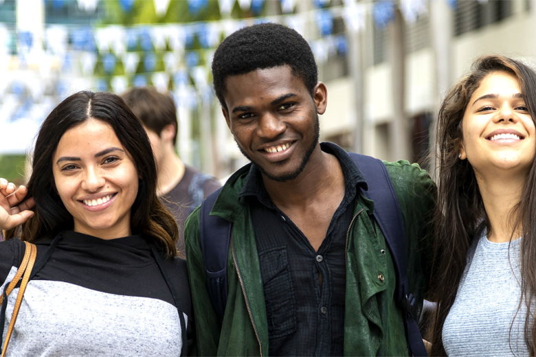 Three students smiling at Wolfson Campus