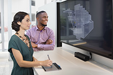Two students looking at a PC monitor