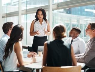 group of professionals holding a meeting