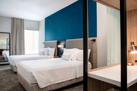Picture of a hotel room with blue and white walls