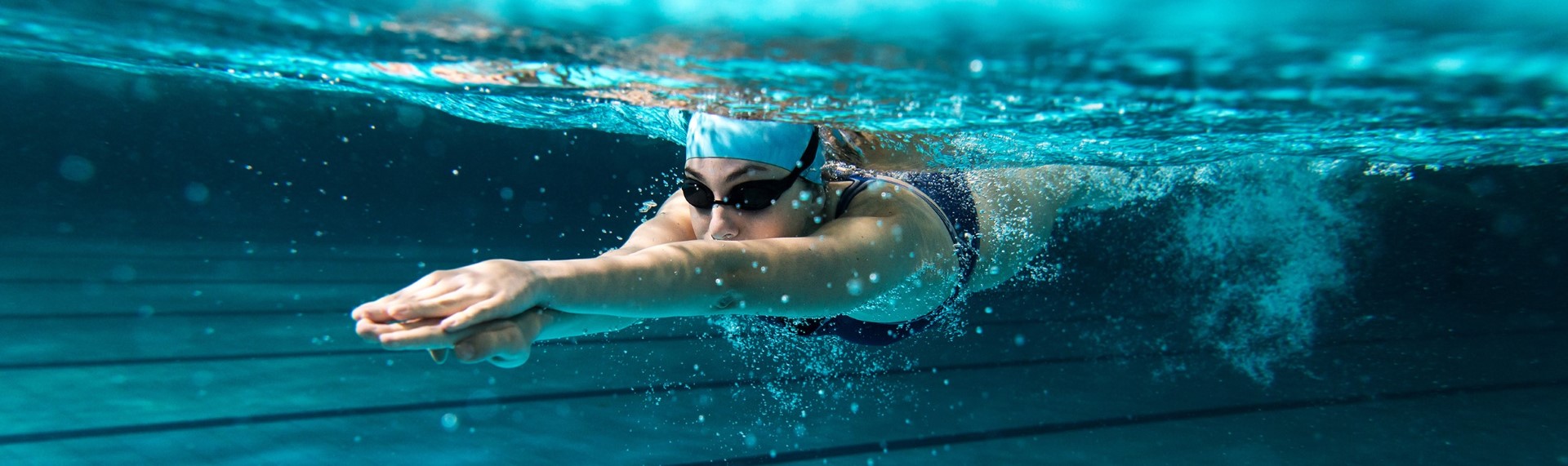 A female swimmer under the water