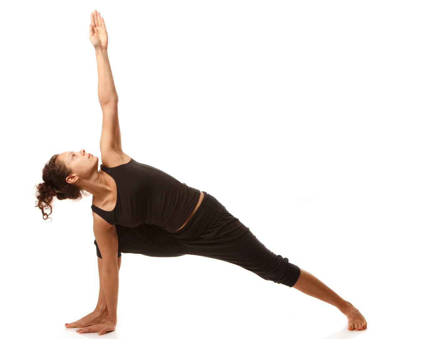 A woman demonstrates the half kneeling twist yoga pose
