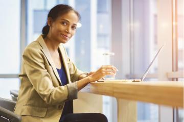 Female counselor sits at a table