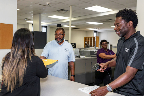 MDC Staff working at the Mailroom/Duplicating center