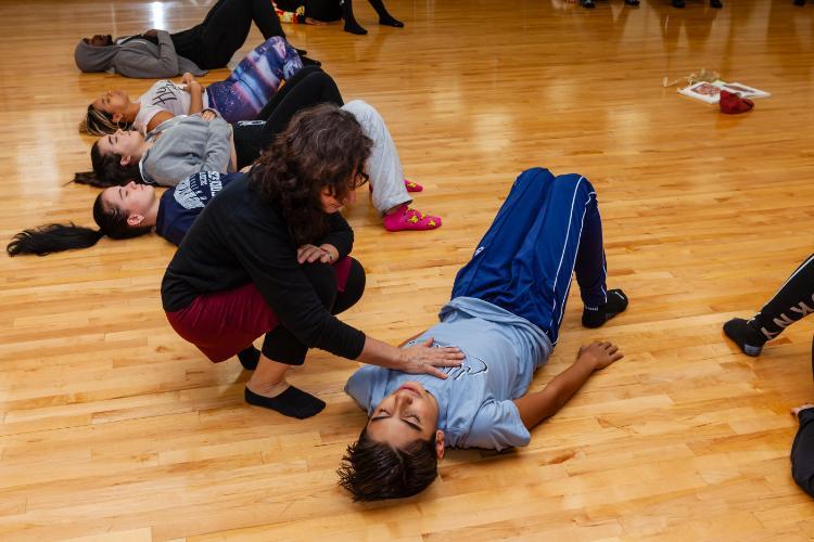 Girl being instructed in exercise routine