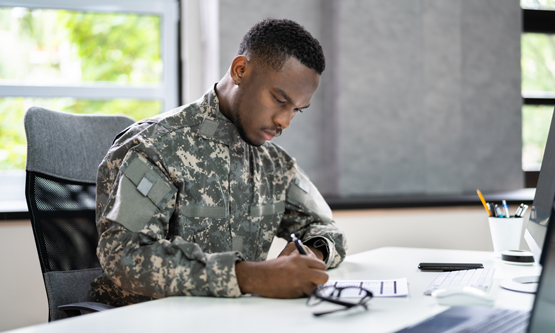 Veteran student filling out a form