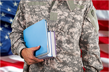 Veteran student holding a notepad and school folders
