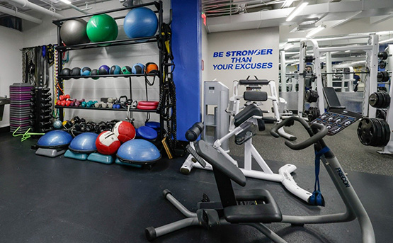 Core machine in front of other gym equipment