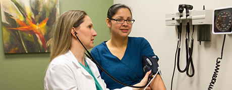 Doctor using an otoscope on a patient