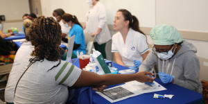 Woman getting sugar measurement at the Community Health Fair