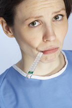 girl taking her own temperature