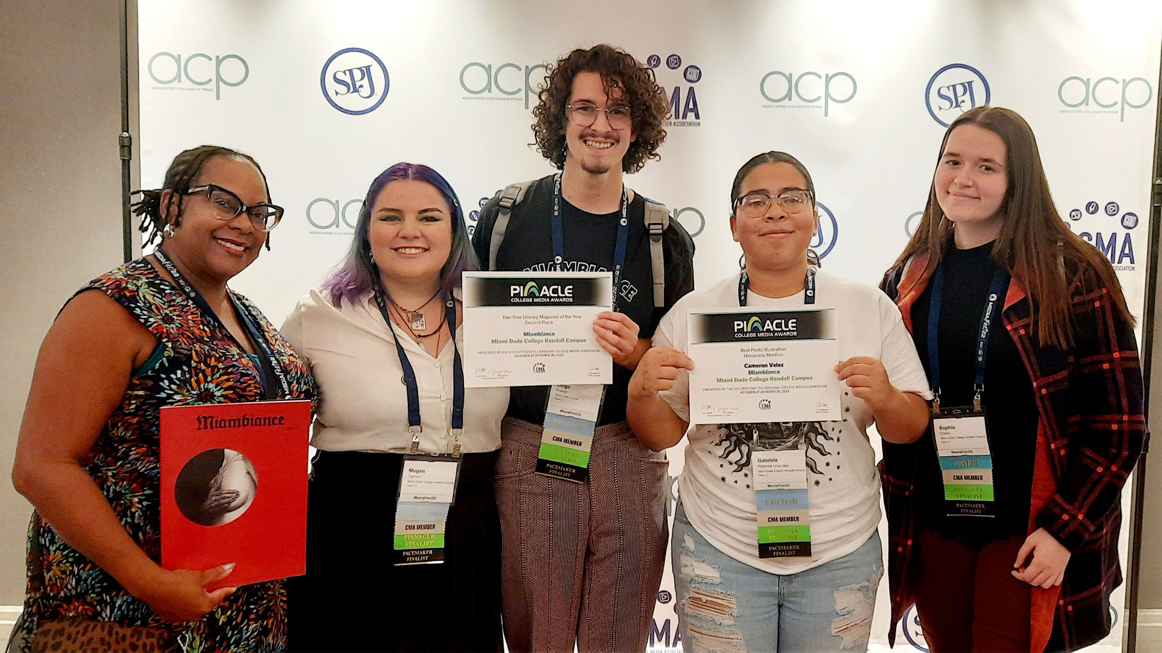 Students and staff pose for a photograph