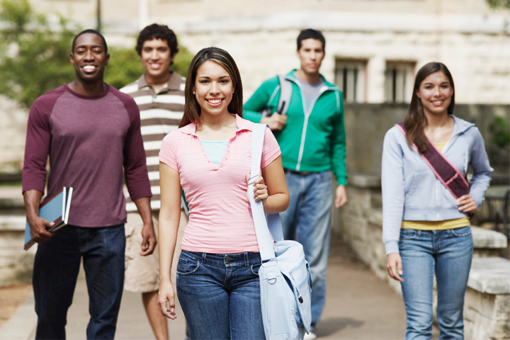 Students walking and smiling