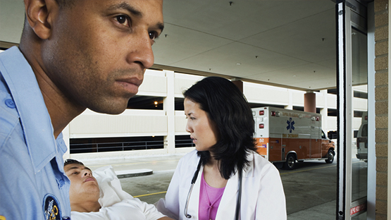 Paramedics helping a person