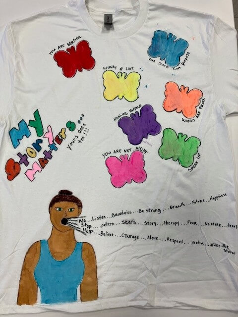 white tee shirt with the words 'my story matters and yours does too' hand painted on it
