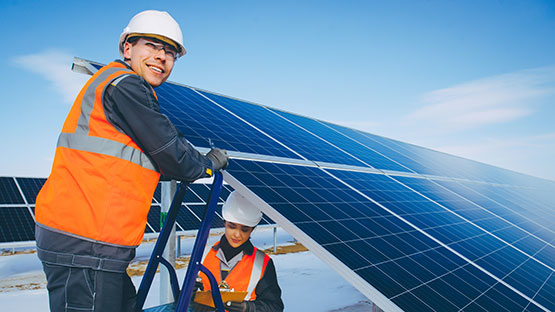 technicians installing solar panel