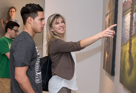 Art lovers view paintings at West Campus's West Gallery