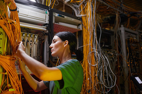 Technician working with network cables
