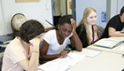 Three female students attending class