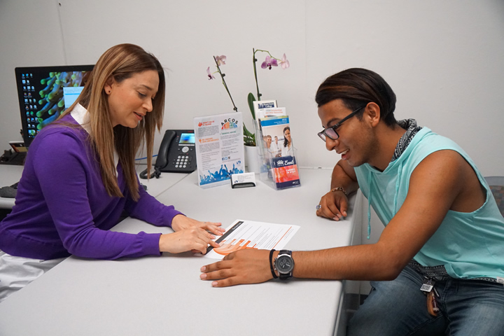 A student meets with an academic advisor in her office
