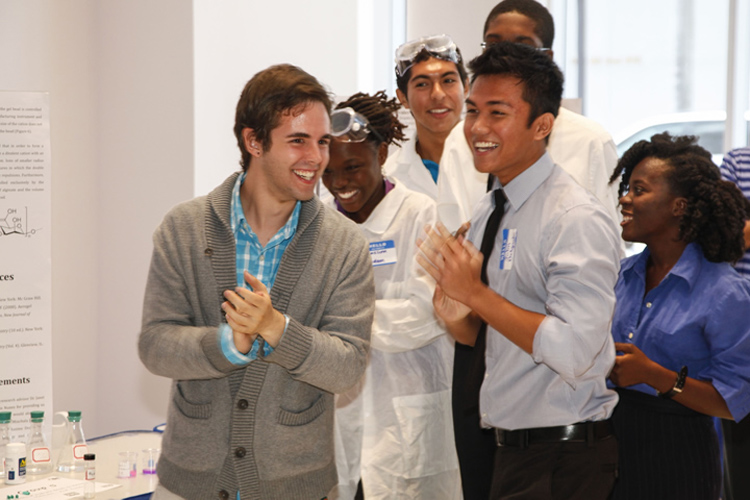 Students celebrate winning first place for their research project